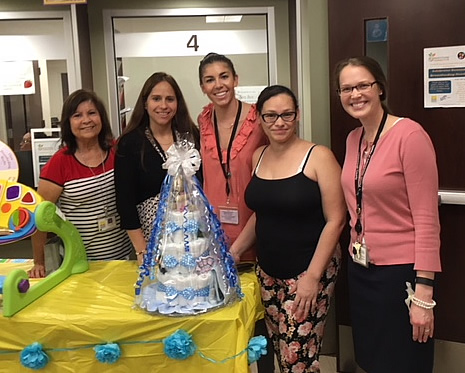 Group photo of WIC staff celebrating moms and babies who breastfeed